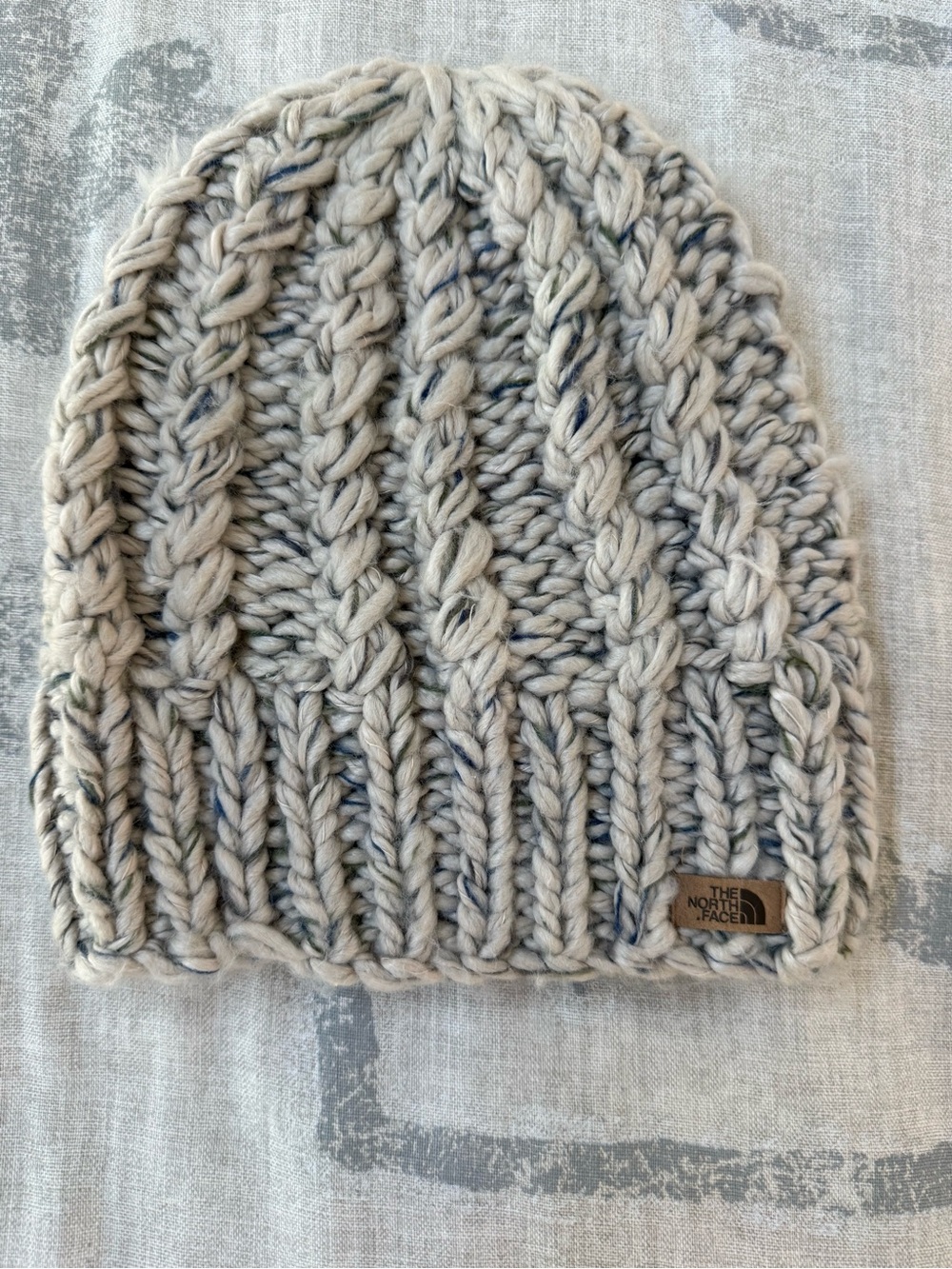 The North Face Chunky Cream Cable-Knit Beanie with Navy Speckle